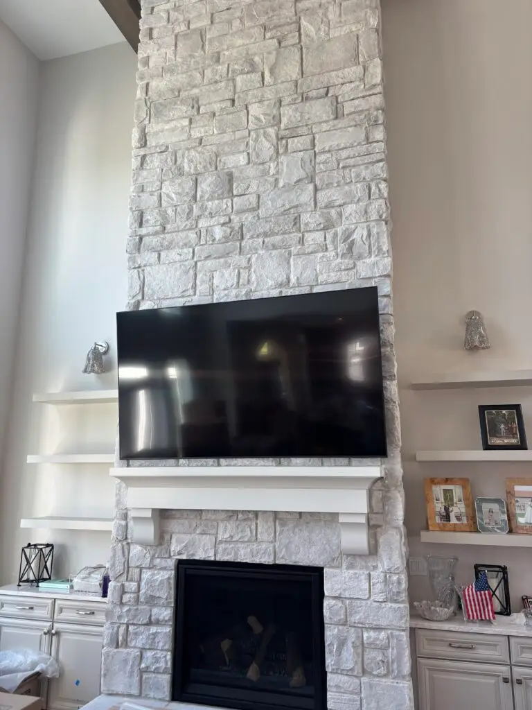 TV Installation Over Stone Fireplace in Holland — gas fireplace tv setup